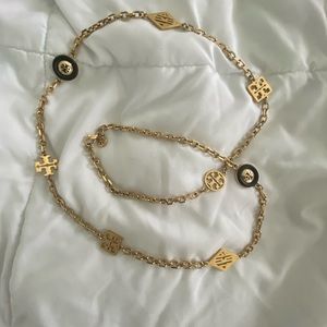 Tory Burch gold necklace with blue accent pendants